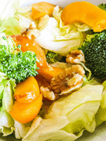 apricot, walnut and broccoli salad in a bowl