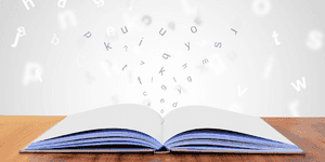 letters rising out of the pages of a book